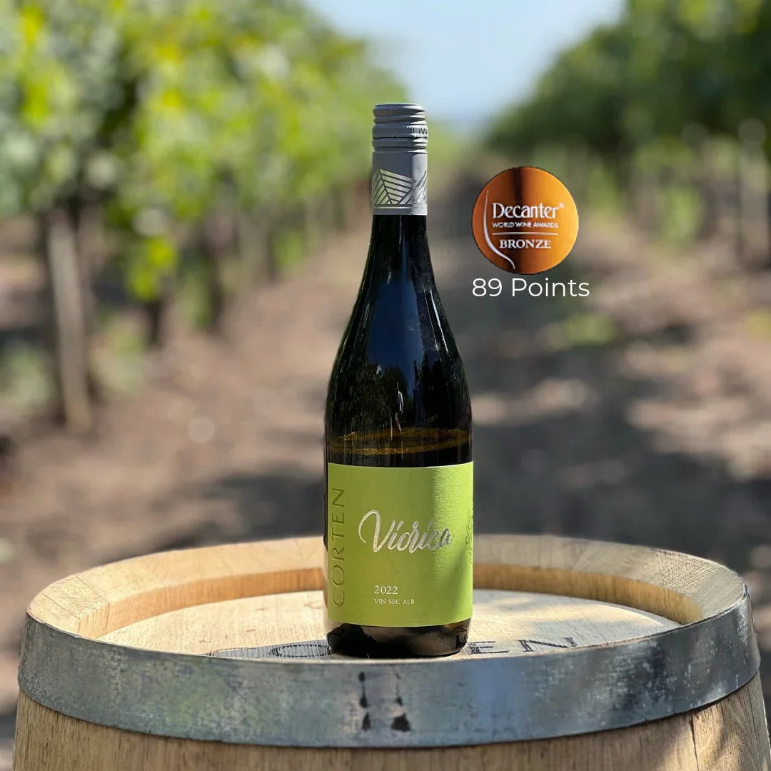 Viorica 2022 Moldovan white wine bottle on barrel in vineyard, Decanter bronze award, 89 points