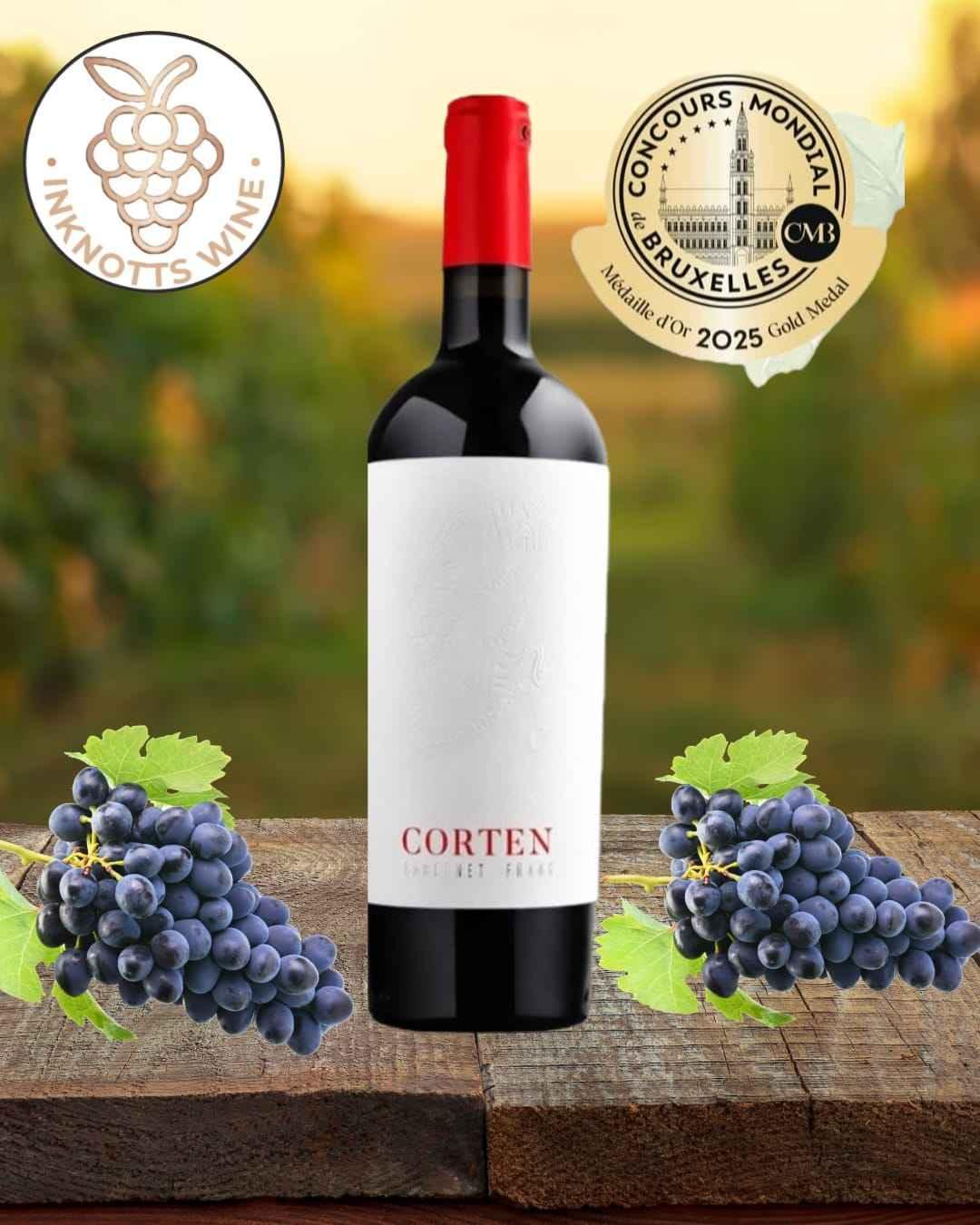 Corten Cabernet Franc wine bottle with red cap on wood, grape clusters and gold award badge