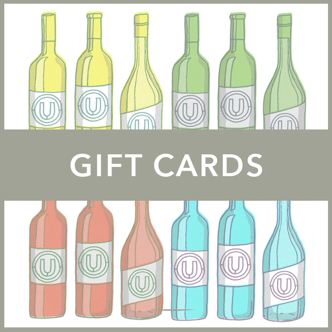 A graphic showing illustrated wine bottles in multiple colors arranged above and below the words 'GIFT CARDS' on a gray banner. The bottles are shown in yellow-green, green, peach, and blue tones, each with a circular 'U' logo on the label.