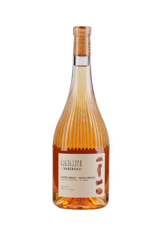A bottle of Naberauli Rachuli Mtsvane orange wine, featuring a ribbed glass bottle filled with golden amber liquid, topped with a cork, and a cream-colored label.